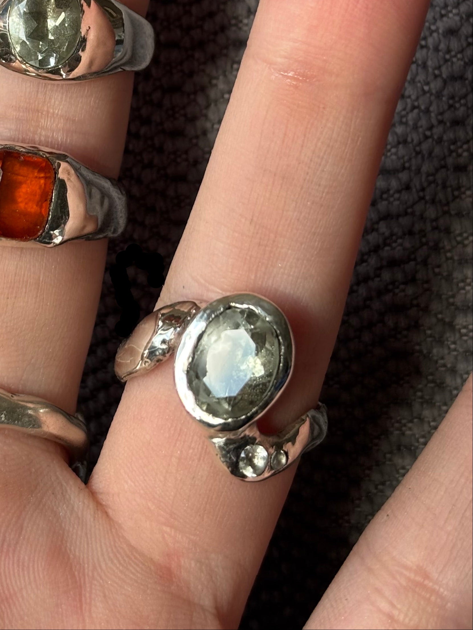 Periodt and topaz ring